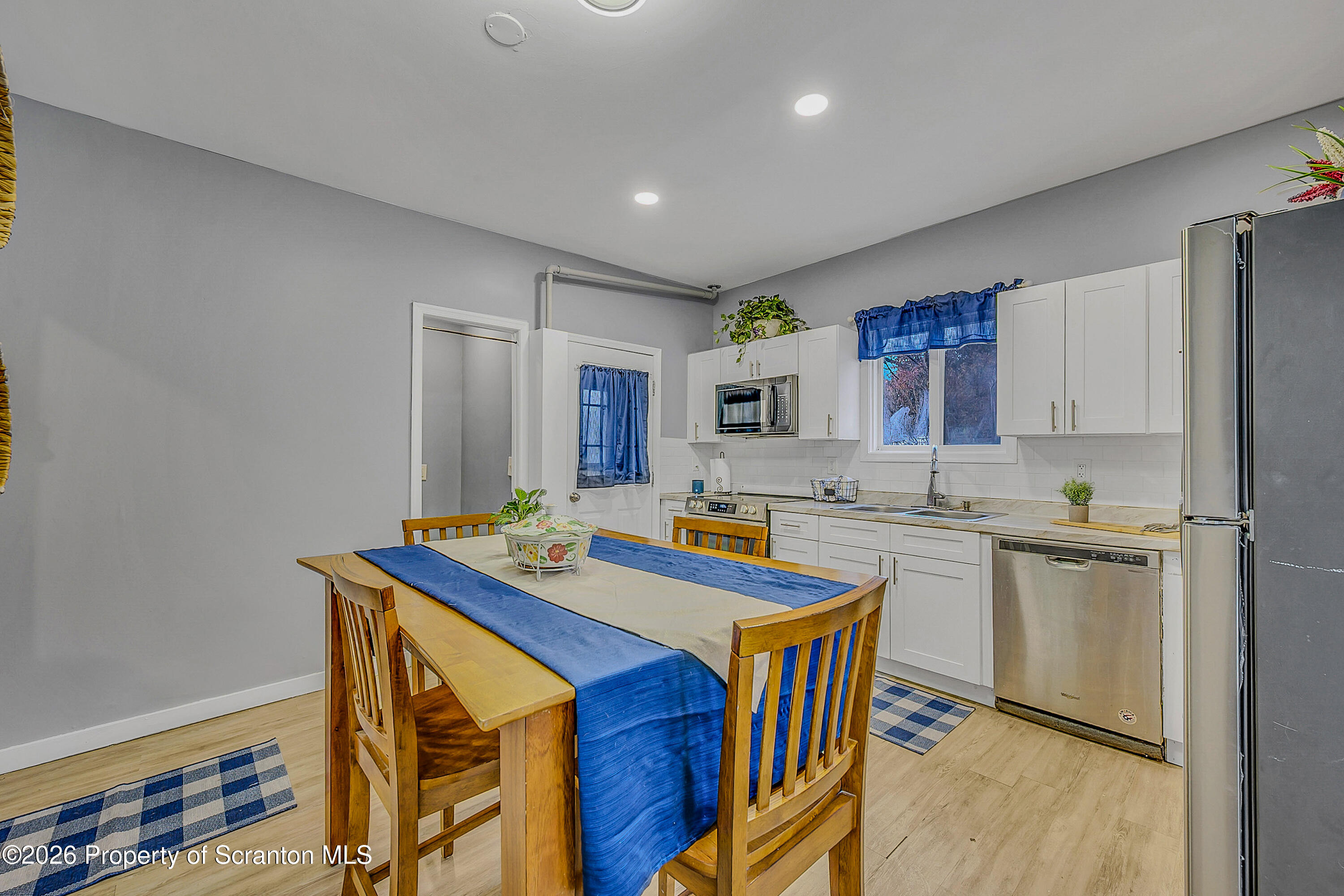 215 North Fillmore Avenue Scranton, PA 18504 - Photo 8 of 25 a kitchen with stainless steel appliances granite countertop a sink stove and refrigerator