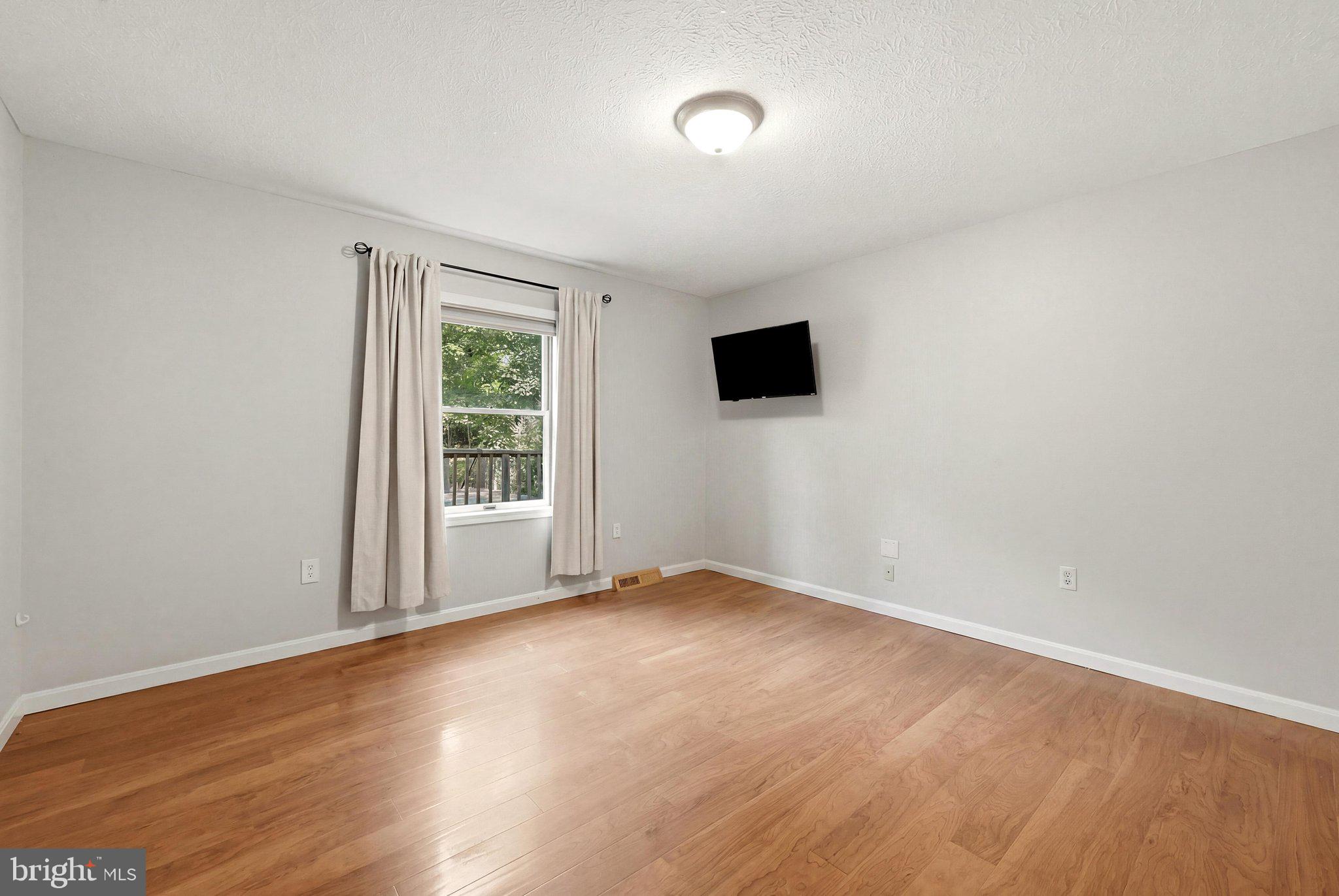 150 Holiday Road Cross Junction, VA 22625 - Photo 32 of 97 The first of two bedrooms on the main level