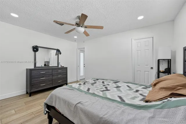 a bathroom with a tub and toilet