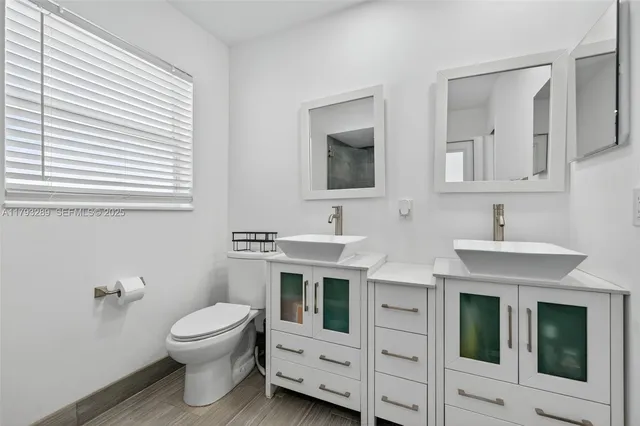 a kitchen with stainless steel appliances granite countertop sink stove and microwave