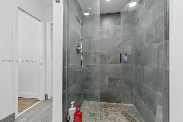 a kitchen with stainless steel appliances granite countertop a sink and a stove