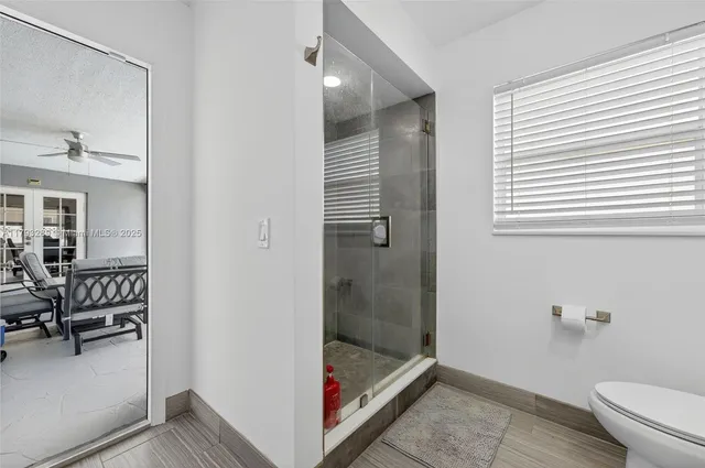 a kitchen with stainless steel appliances granite countertop a sink and a stove