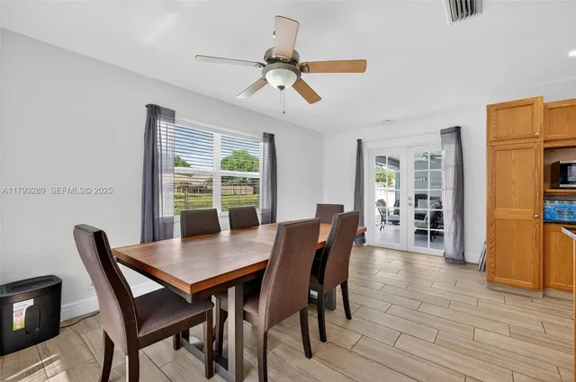 a view of a livingroom with furniture and windows