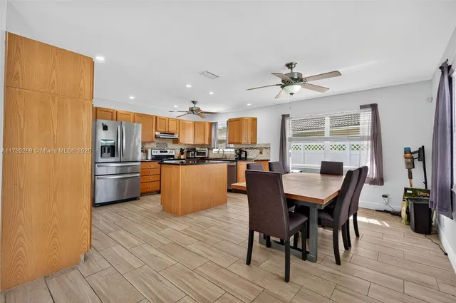 a view of a livingroom with furniture and windows
