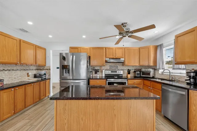 a view of house with backyard