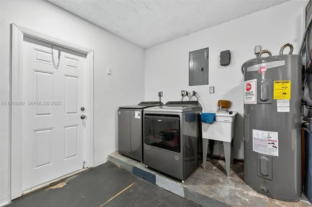 an aerial view of residential house with outdoor space and swimming pool