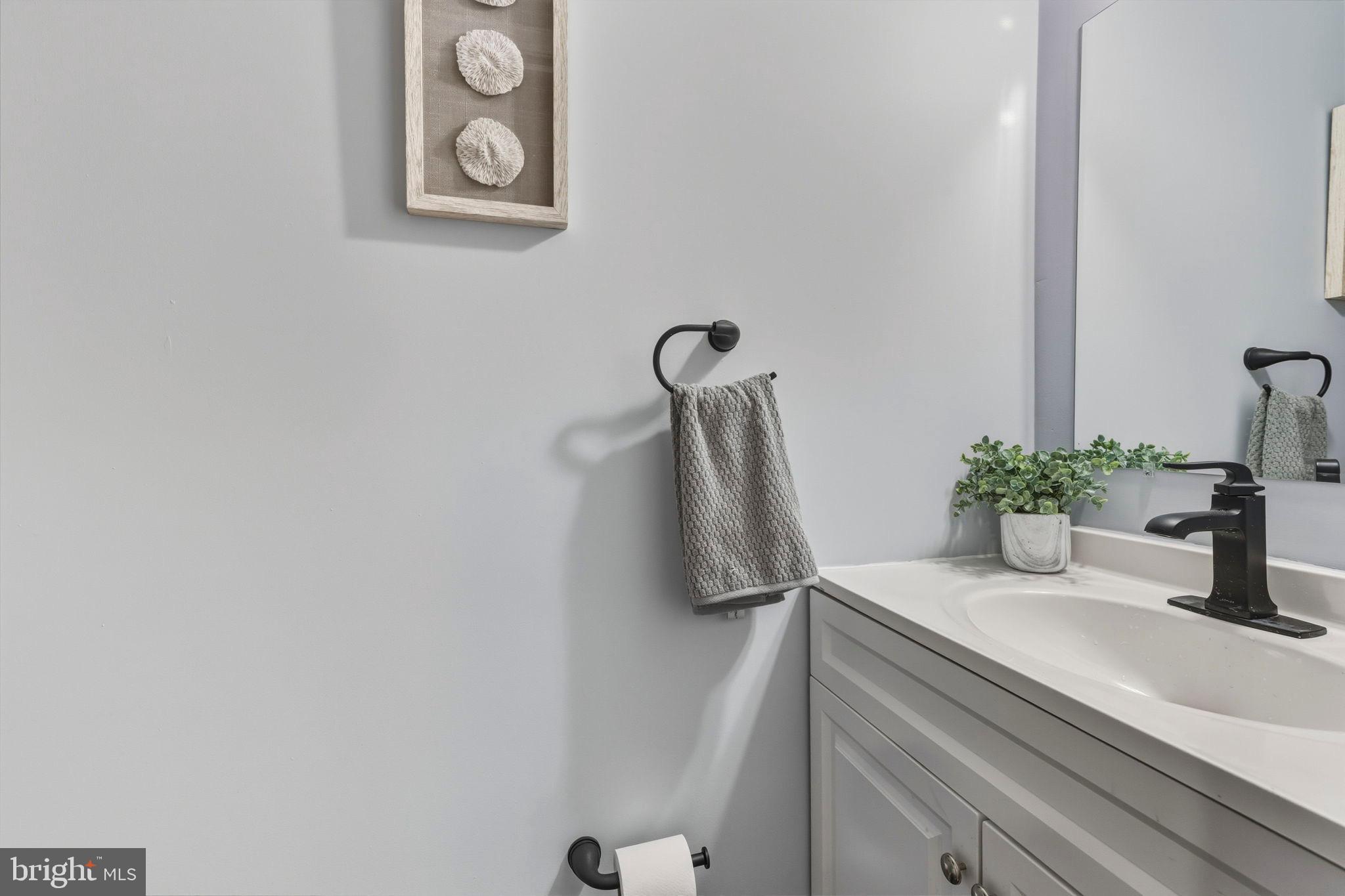 1618 North Regester Street Baltimore, MD 21213 - Photo 11 of 29 a bathroom with a sink and a mirror