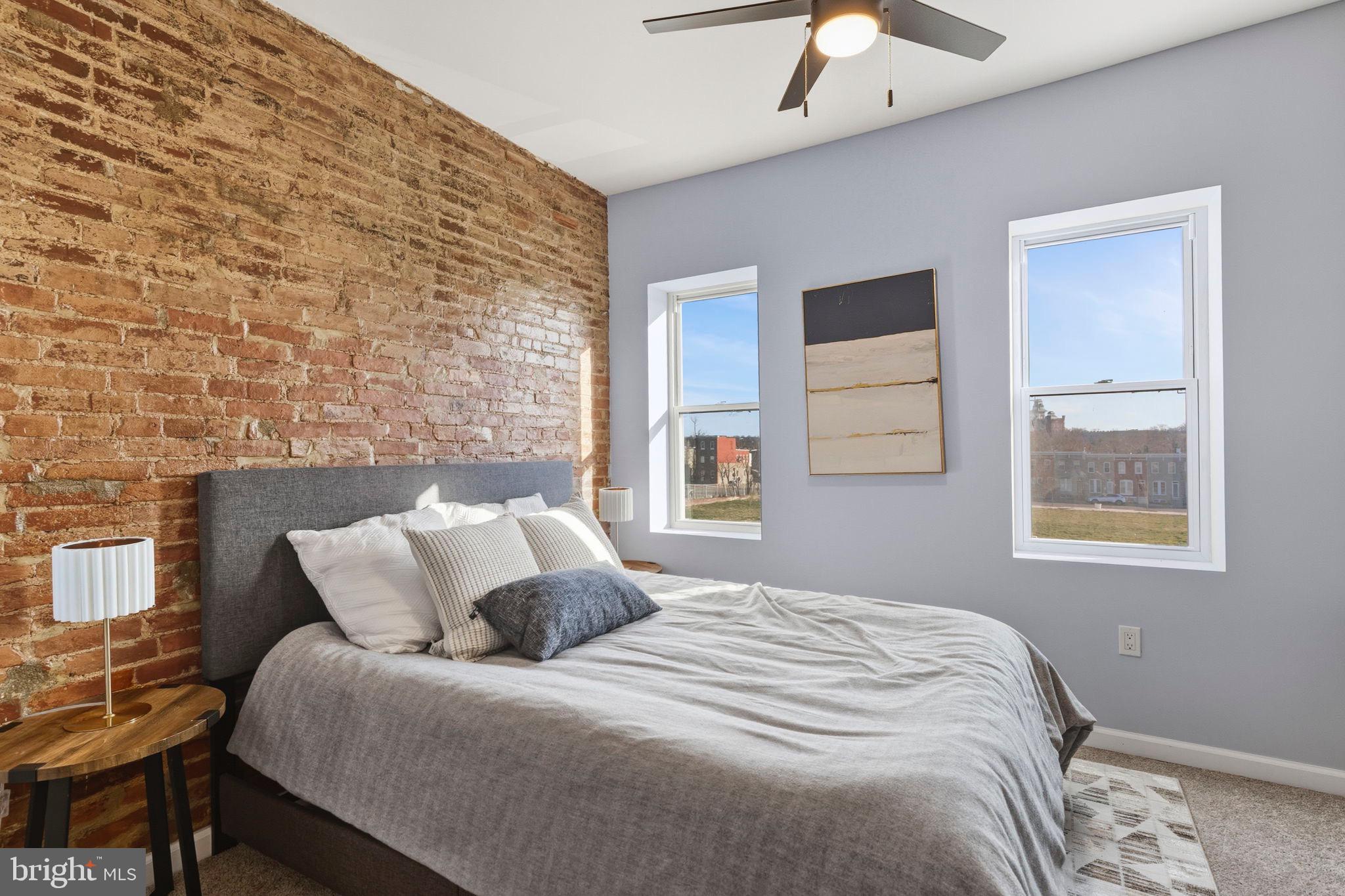 1618 North Regester Street Baltimore, MD 21213 - Photo 14 of 29 a bedroom with a bed and a window
