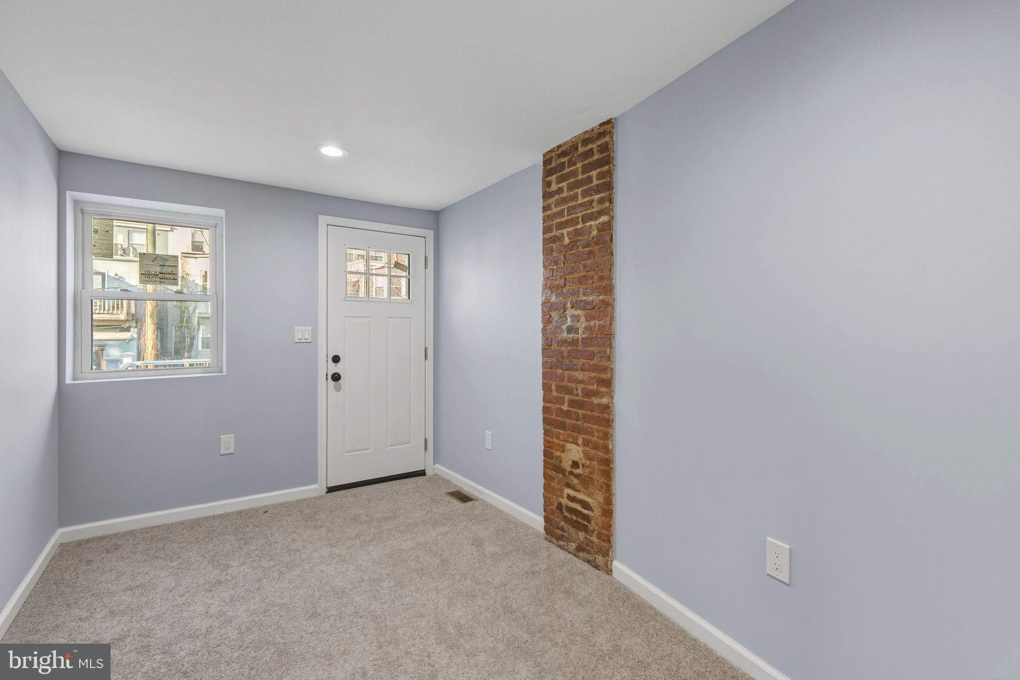 1618 North Regester Street Baltimore, MD 21213 - Photo 19 of 29 a view of an empty room and window