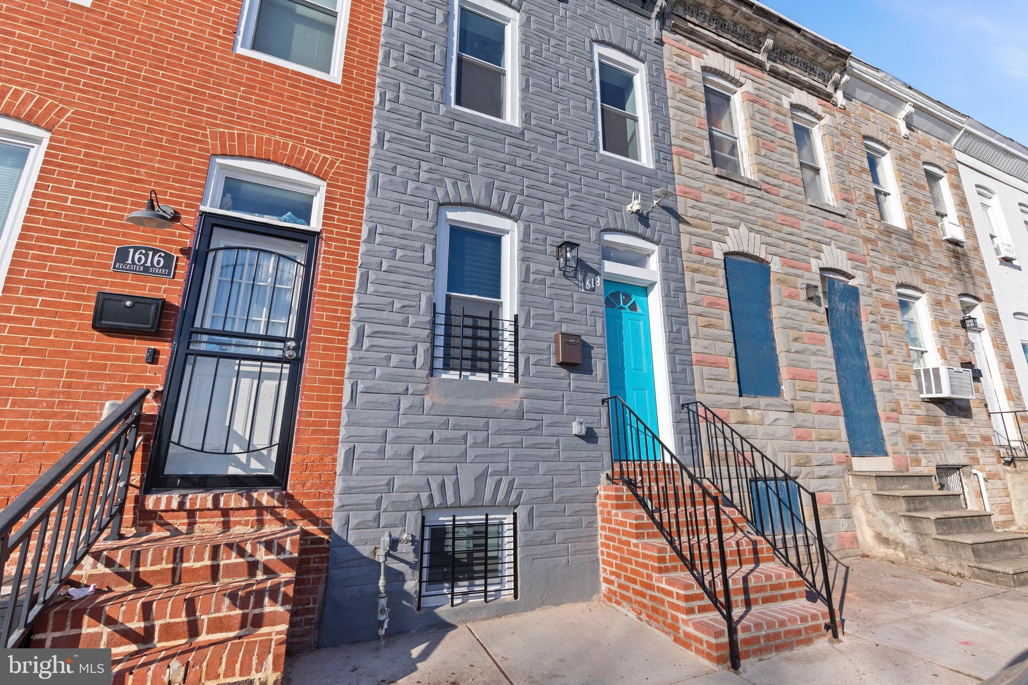 1618 North Regester Street Baltimore, MD 21213 - Photo 2 of 29 an outdoor view of a brick building with many windows