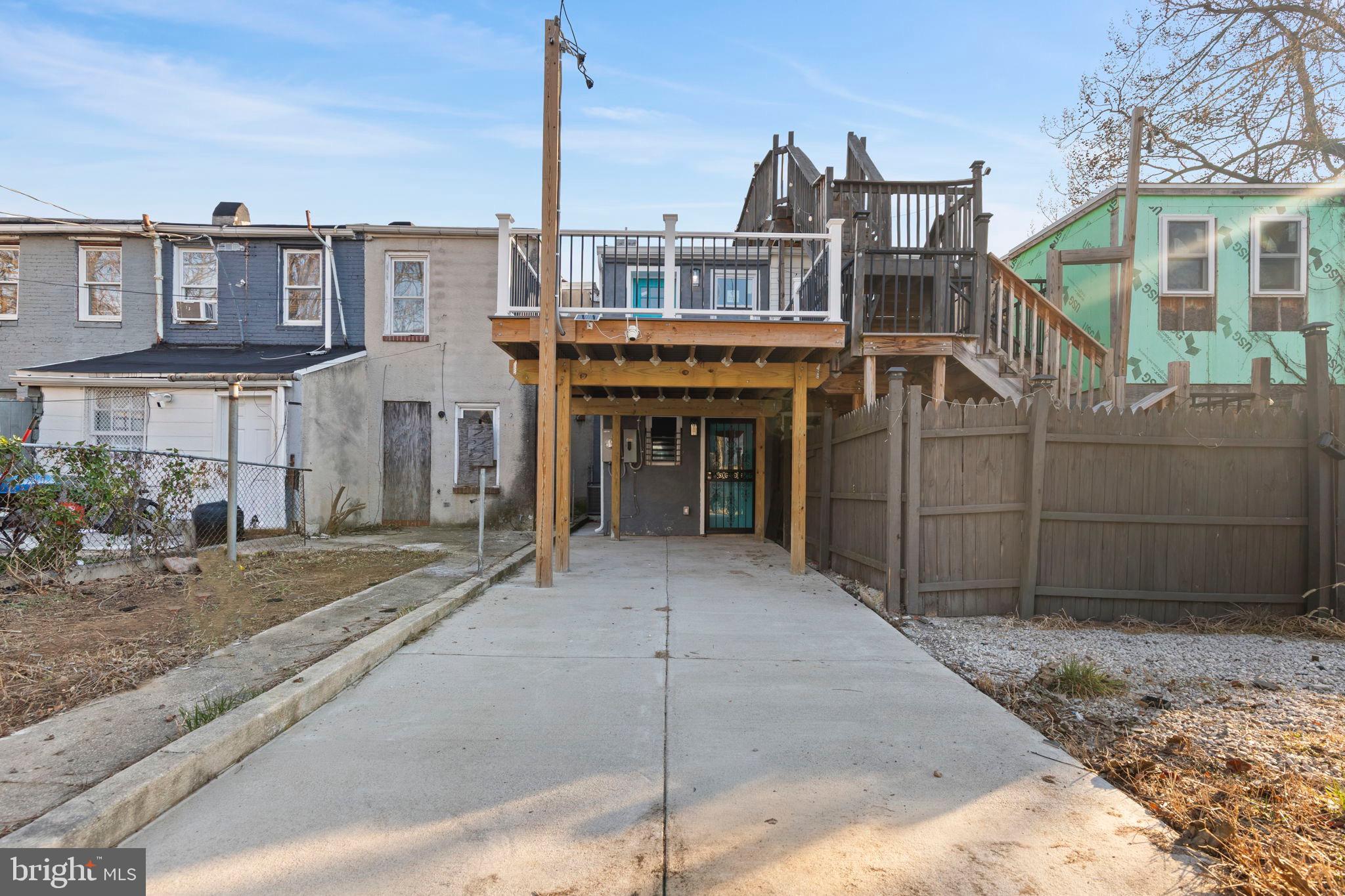 1618 North Regester Street Baltimore, MD 21213 - Photo 22 of 29 a view of a house with a backyard