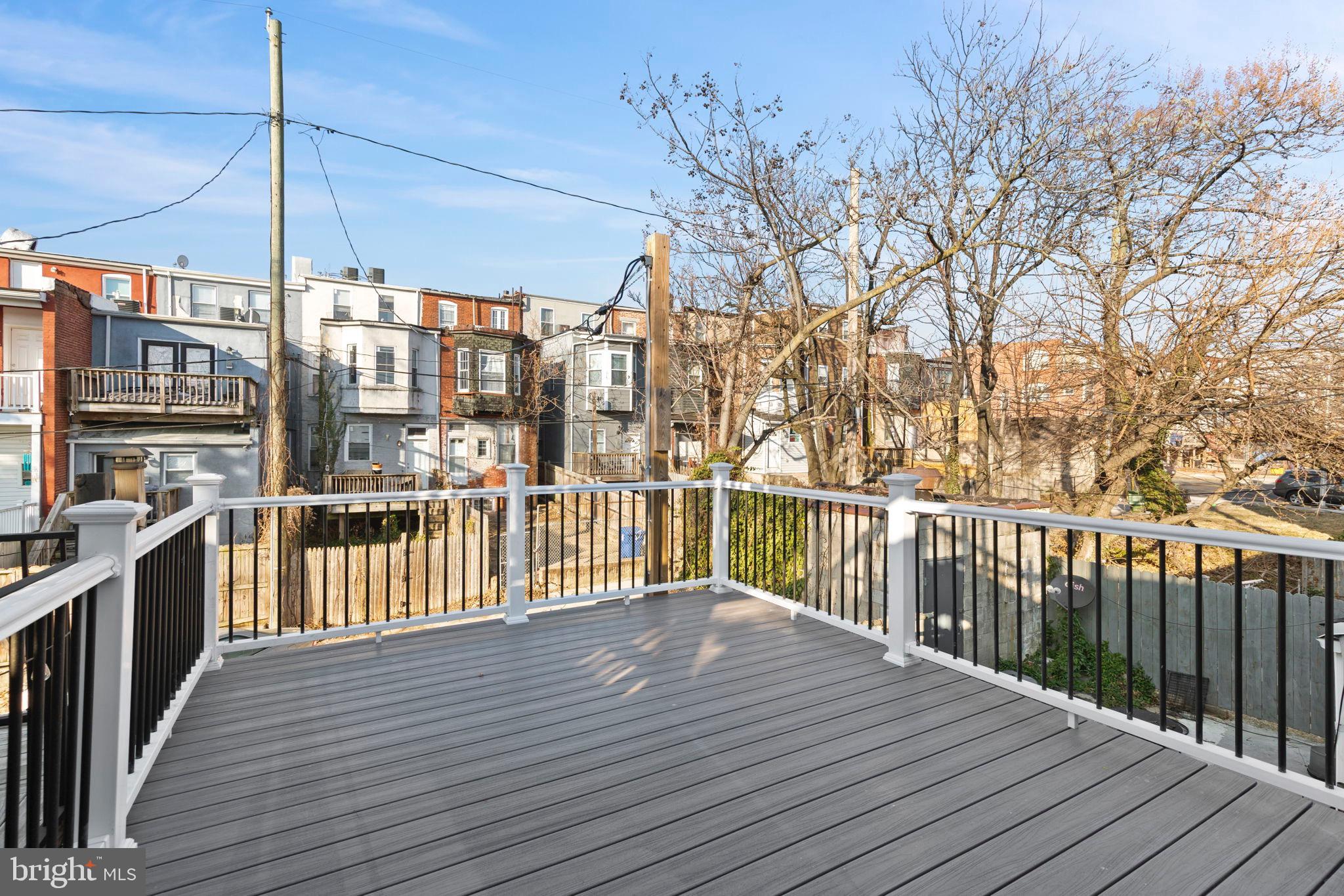 1618 North Regester Street Baltimore, MD 21213 - Photo 23 of 29 a view of a balcony with wooden floor