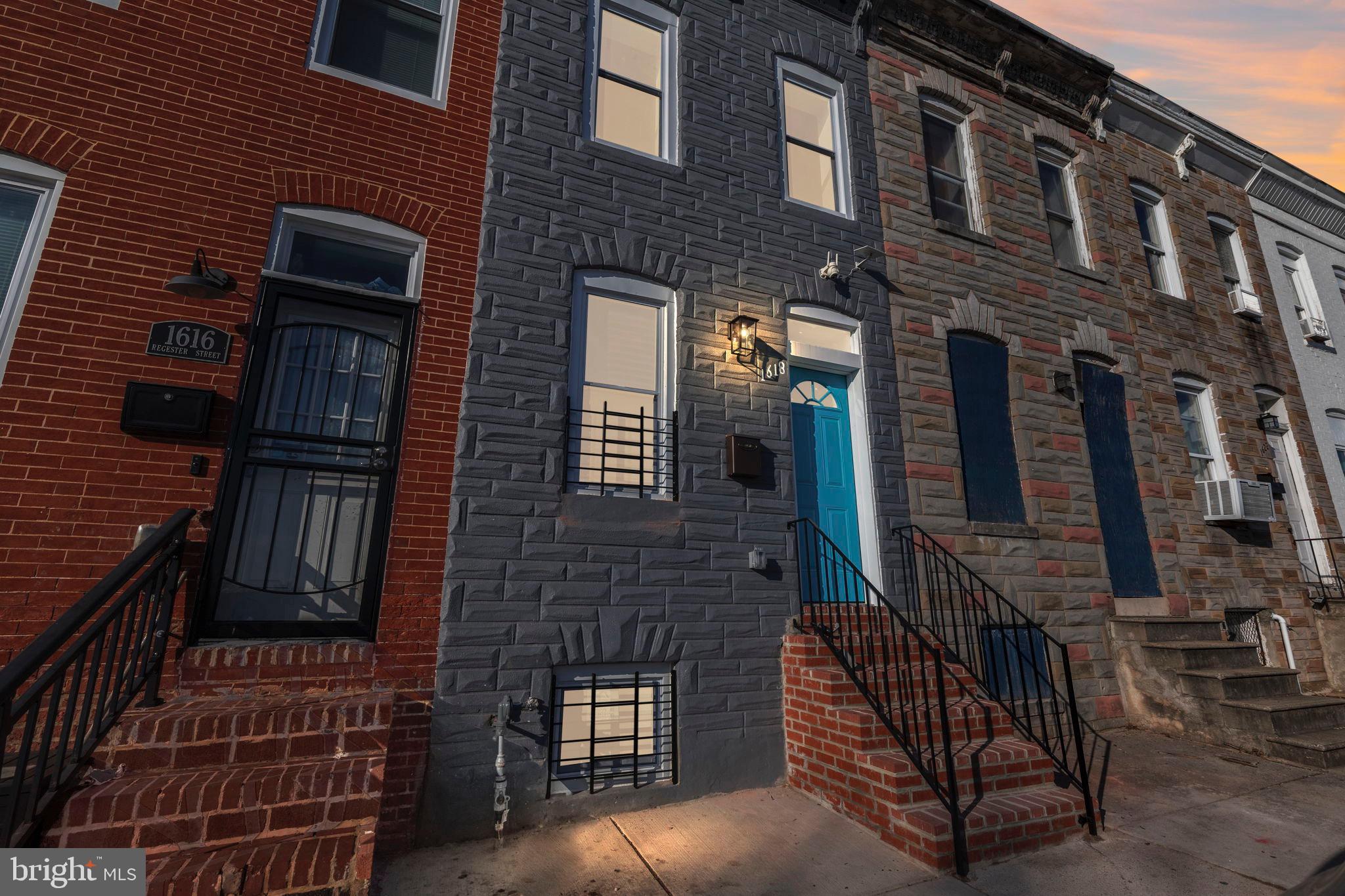 1618 North Regester Street Baltimore, MD 21213 - Photo 4 of 29 a brick building with a large door