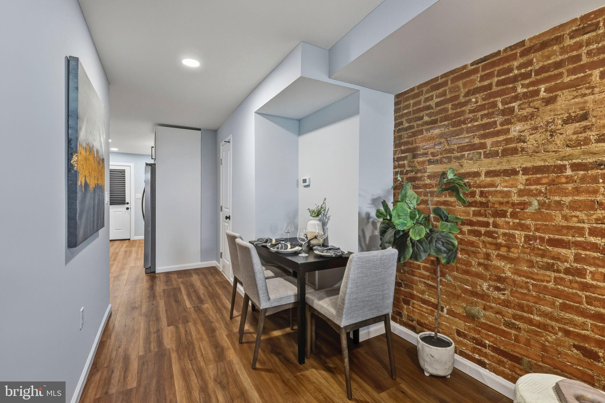 1618 North Regester Street Baltimore, MD 21213 - Photo 6 of 29 a view of a dining room with furniture and wooden floor