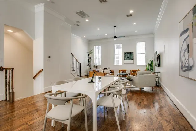 a very nice looking living room with wooden floor and furniture