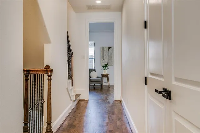a view of a hallway with a dining area hardwood floor and hallway