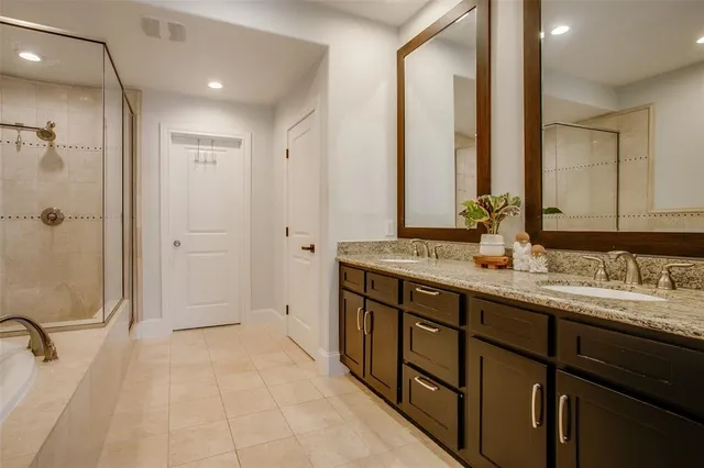 a bathroom with a double vanity sink mirror and double