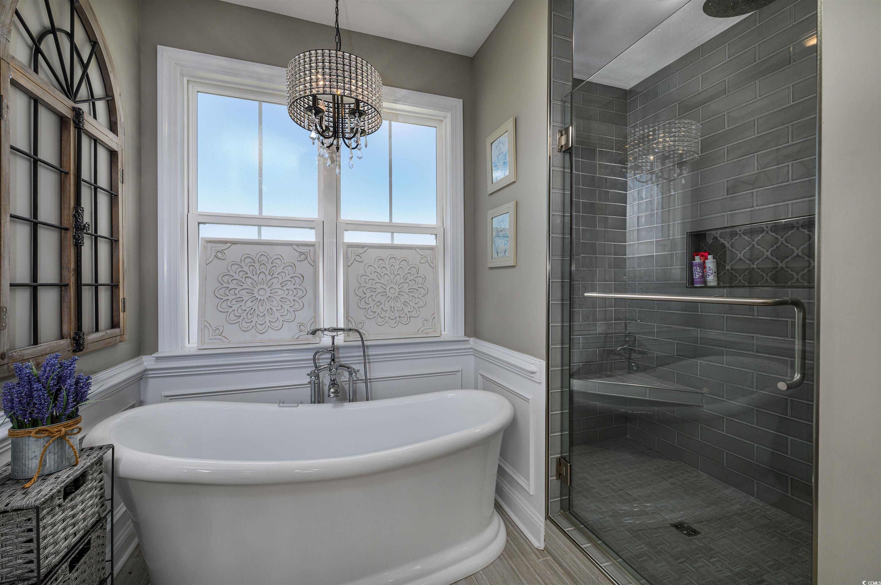 250 Samuel Road Loris, SC 29569 - Photo 17 of 38 Bathroom with a notable chandelier and independent