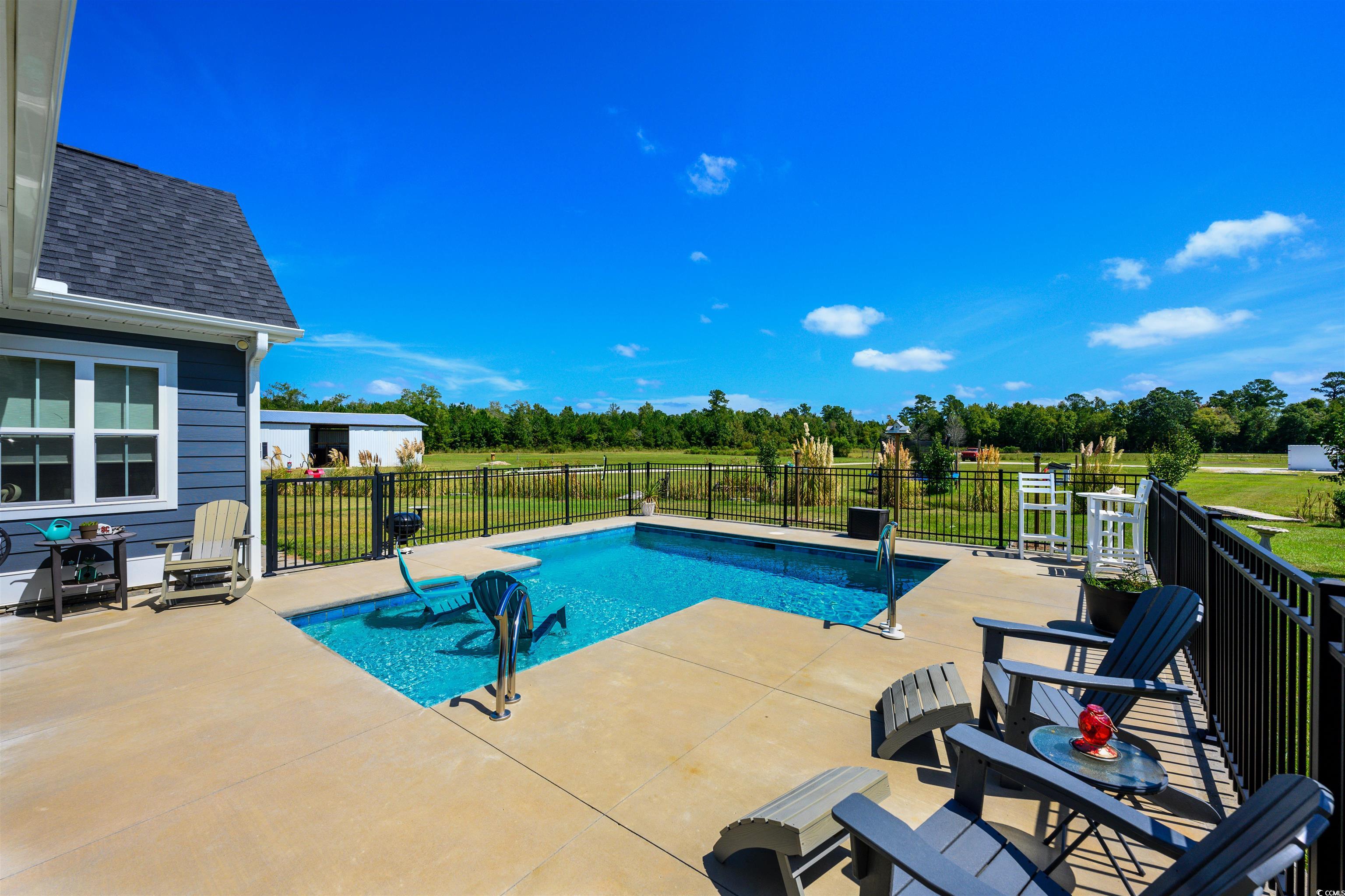 250 Samuel Road Loris, SC 29569 - Photo 27 of 38 View of pool with a patio