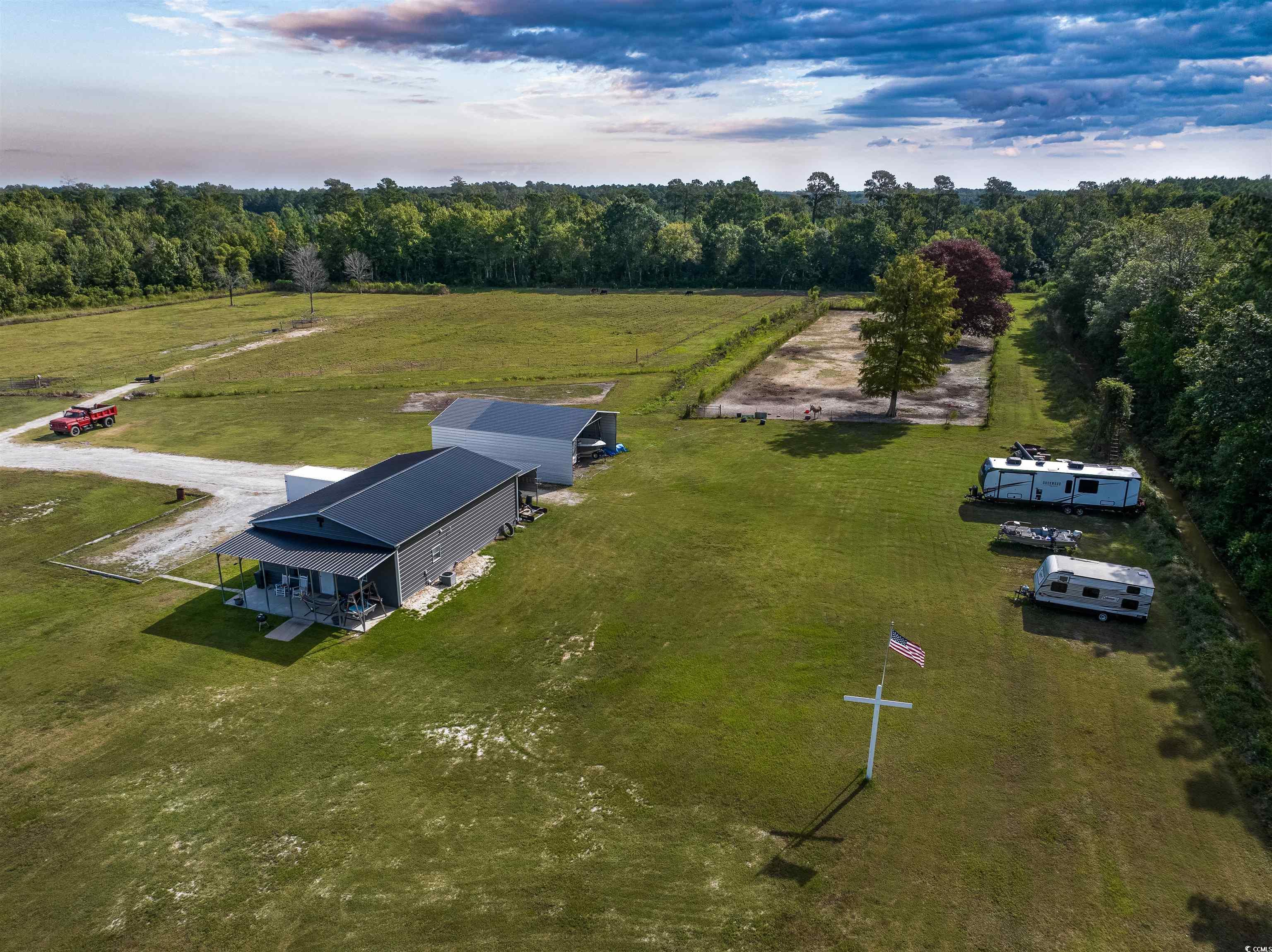 250 Samuel Road Loris, SC 29569 - Photo 37 of 38 Aerial view at dusk featuring a rural view