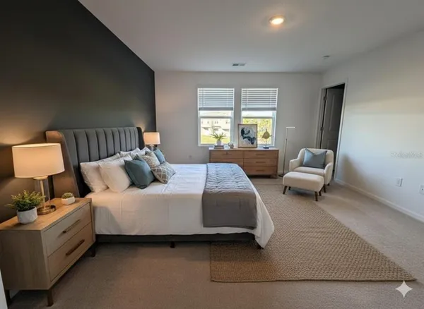 a bedroom with bed and window