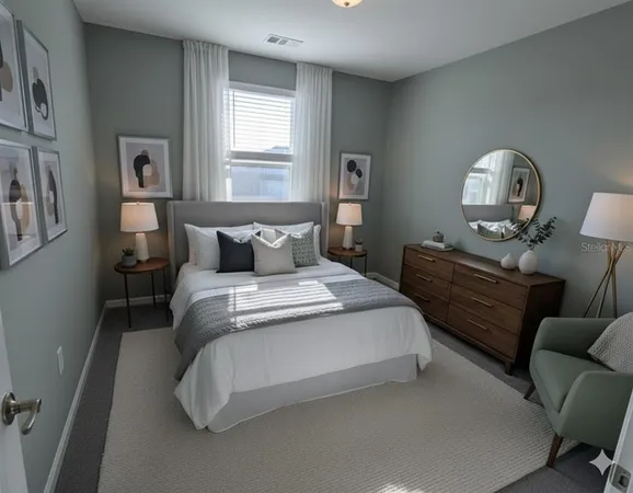 a bedroom with a bed couch and a window