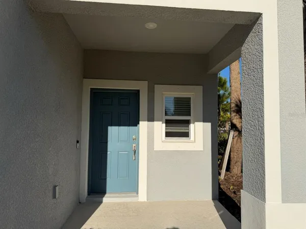 a view of a door and a window