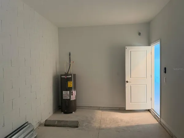 a living room with a couch and a window