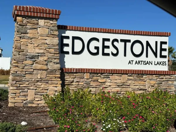 a sign broad in front of a building