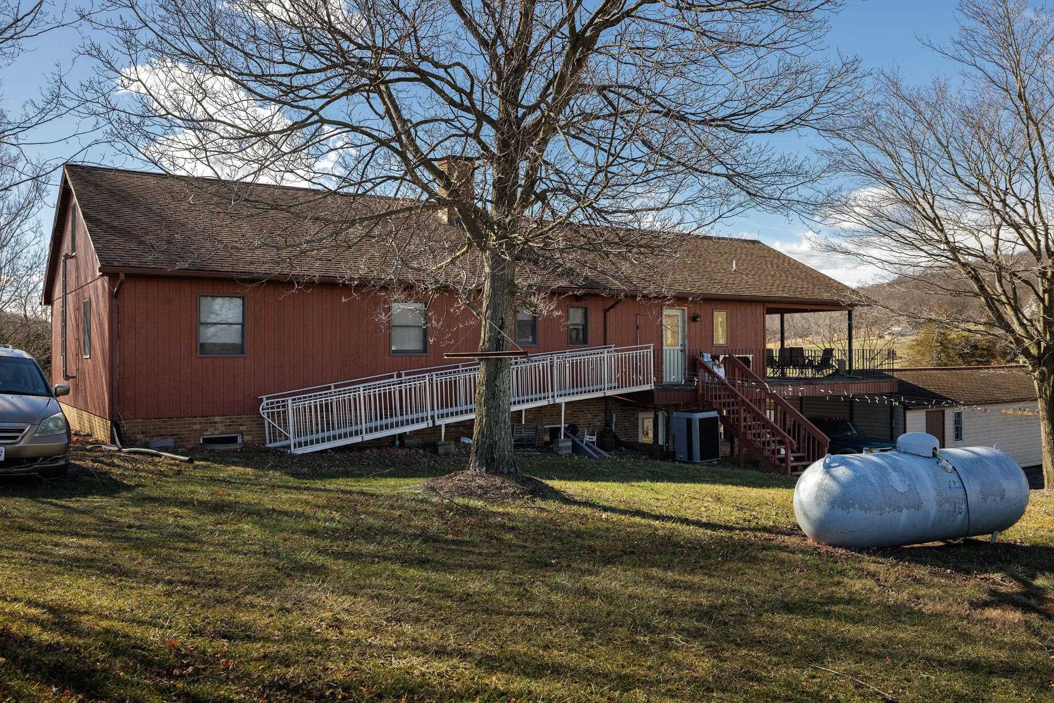 85-87 Curry Road Mount Solon, VA 22843 - Photo 58 of 59 a view of a backyard with table and chairs under an umbrella