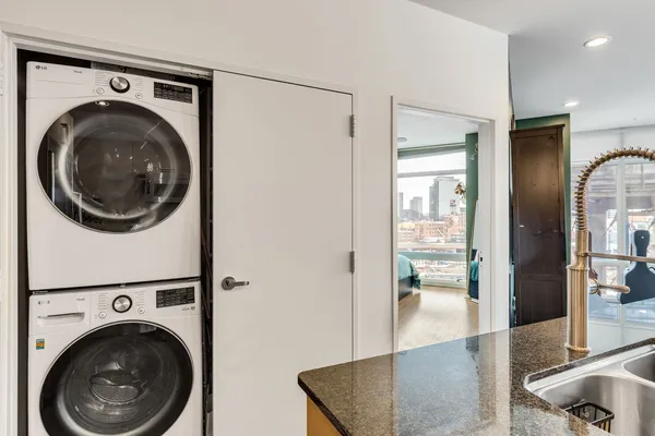 a view of a hallway with washer and dryer