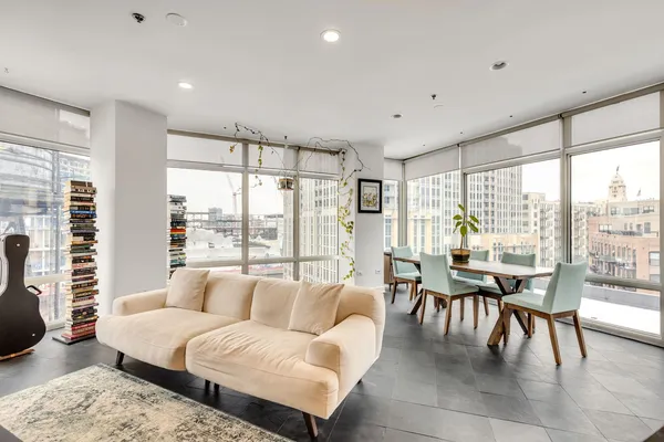 a living room with furniture and a large window