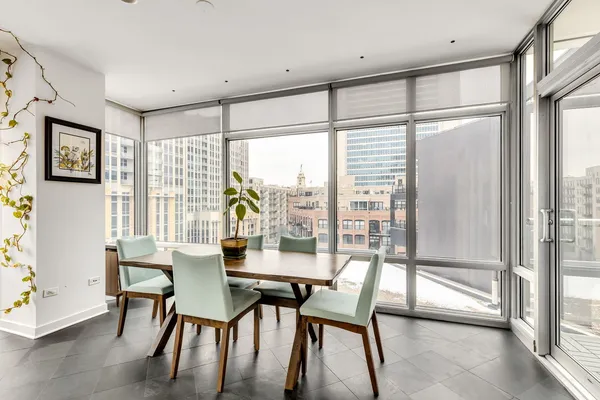 a dining room with furniture and window