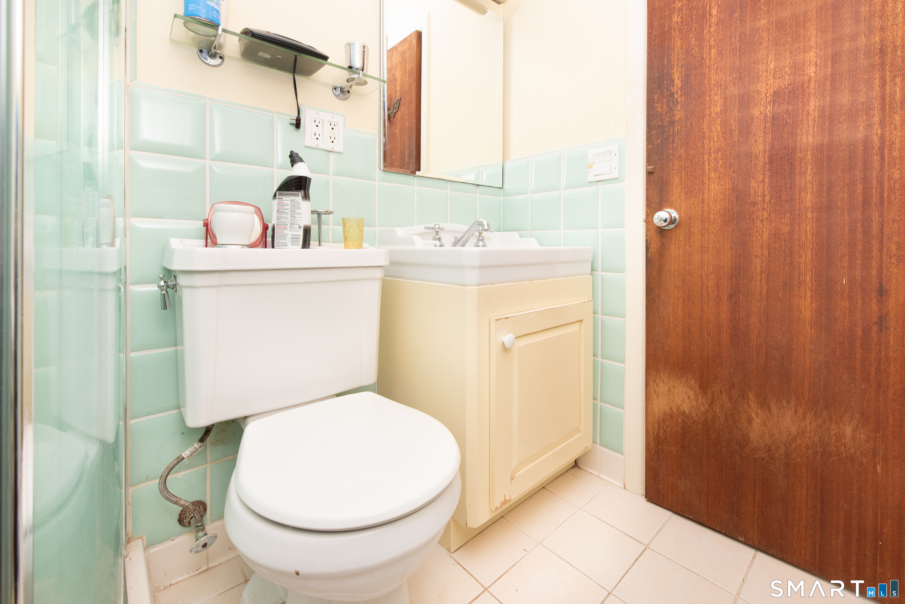 1 Dexter Road Westport, CT 06880 - Photo 15 of 29 a bathroom with a sink a toilet and shower curtain