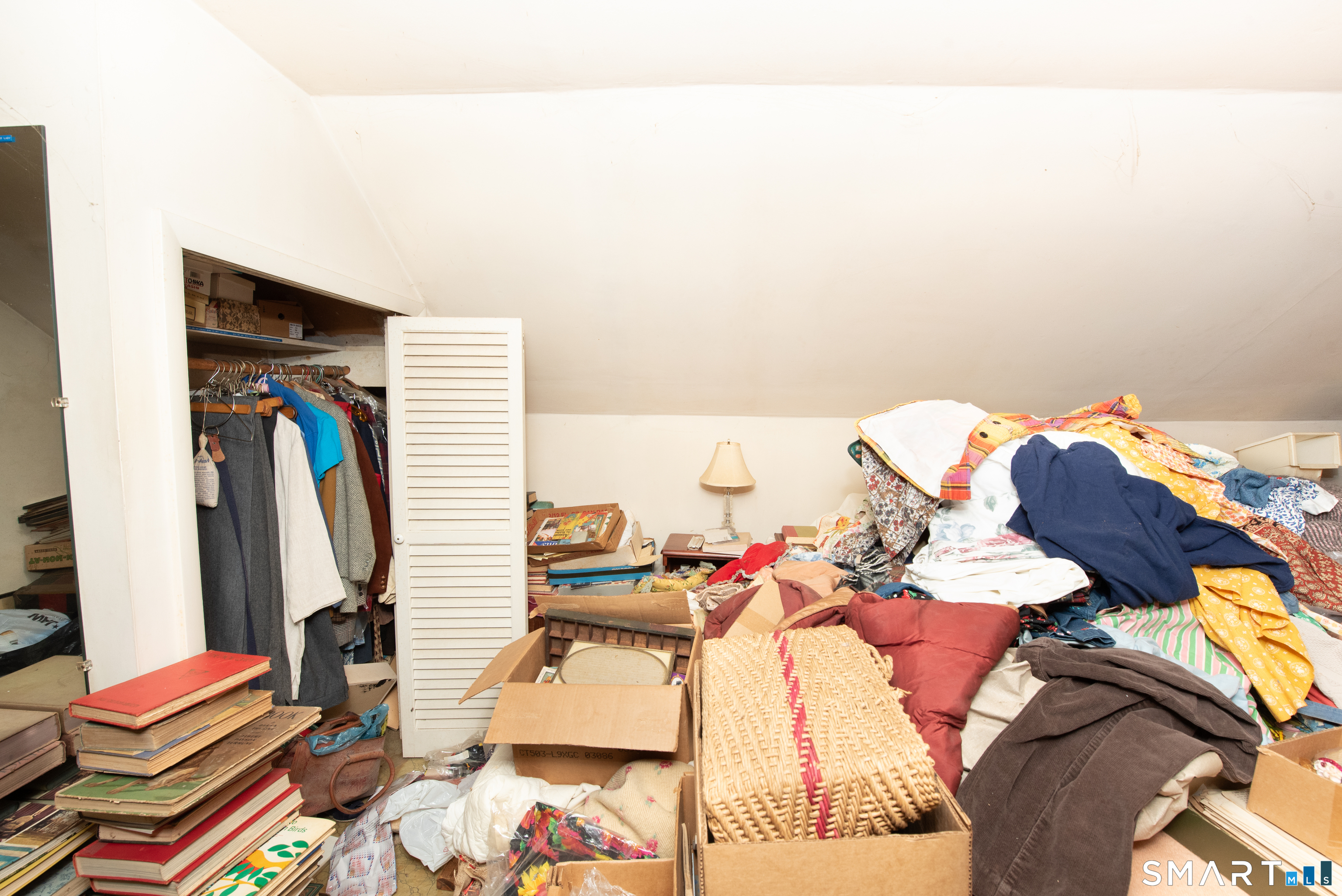 1 Dexter Road Westport, CT 06880 - Photo 20 of 29 a view of walk in closet with clothes and shoes