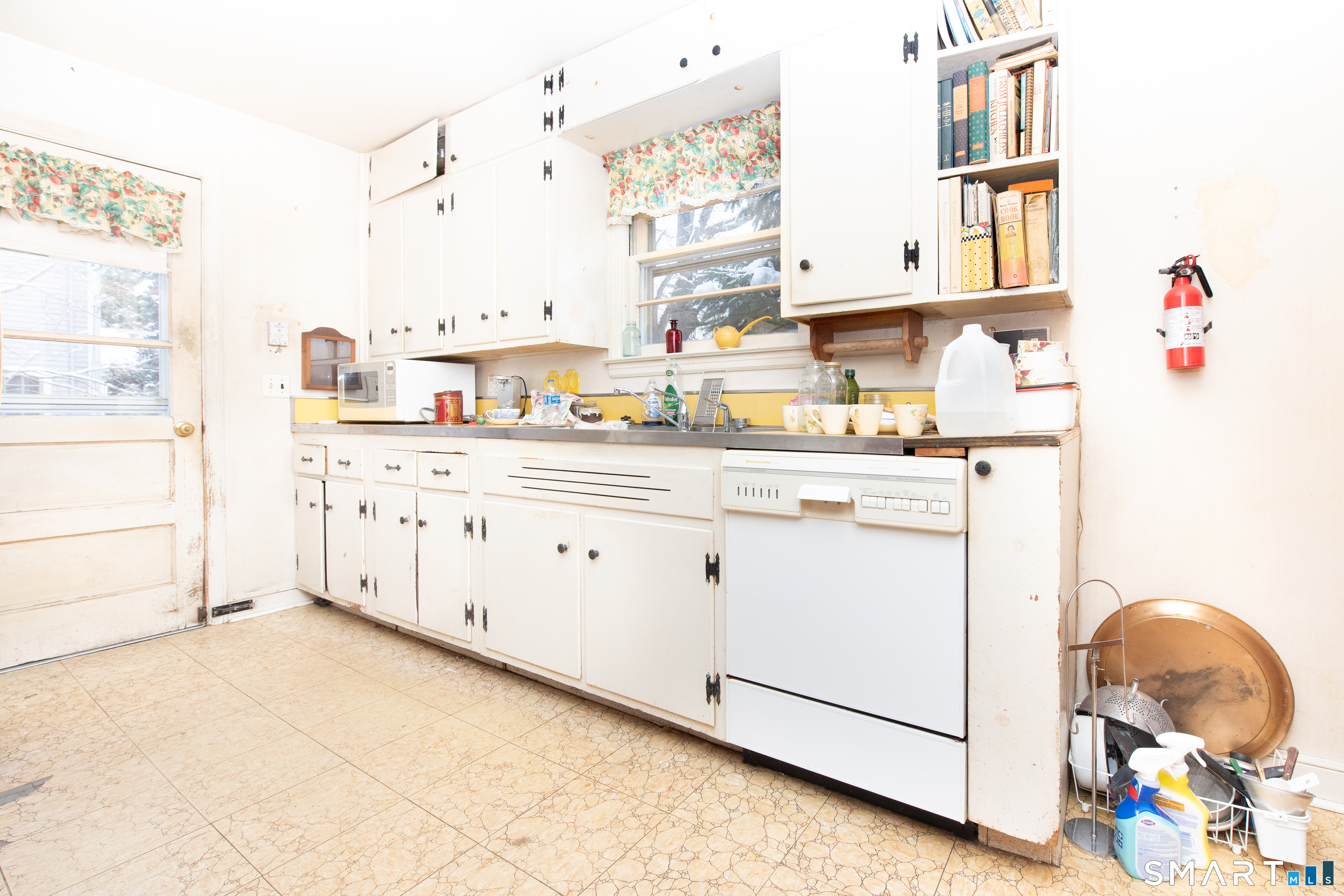 1 Dexter Road Westport, CT 06880 - Photo 5 of 29 a kitchen with stainless steel appliances cabinets a sink and a window