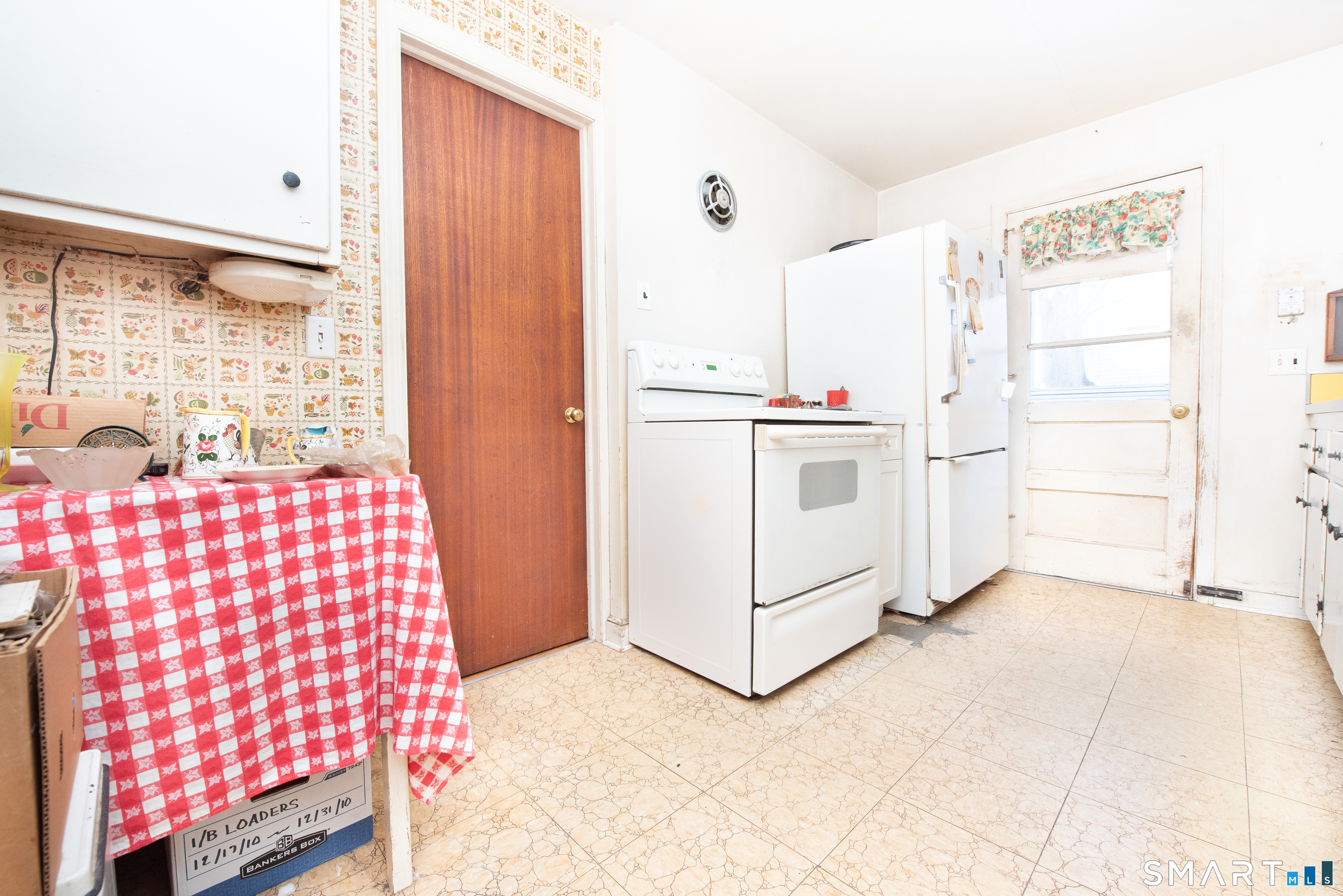 1 Dexter Road Westport, CT 06880 - Photo 6 of 29 a kitchen with a cabinets and white appliances