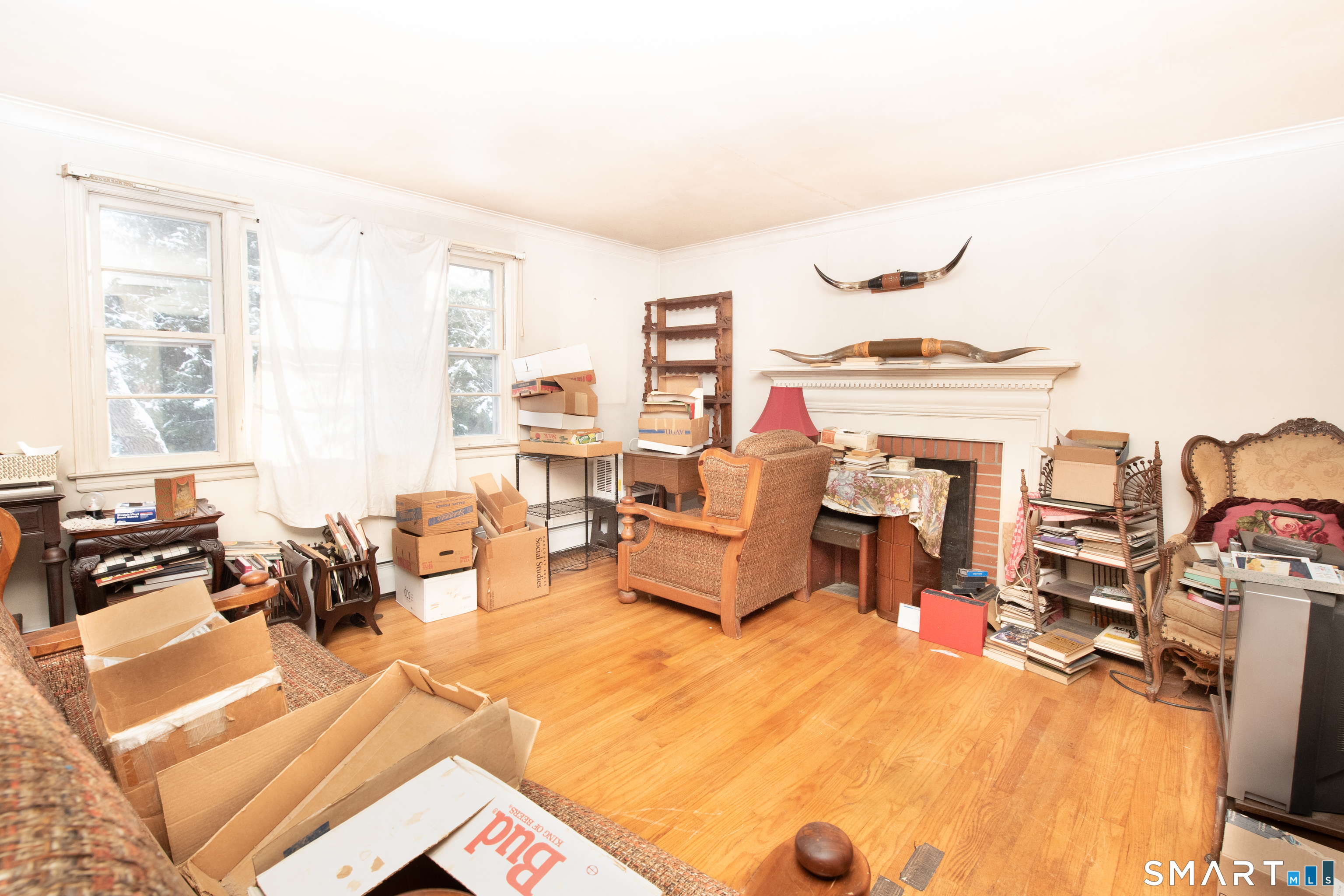 1 Dexter Road Westport, CT 06880 - Photo 10 of 29 a living room with furniture a fireplace and flat screen tv
