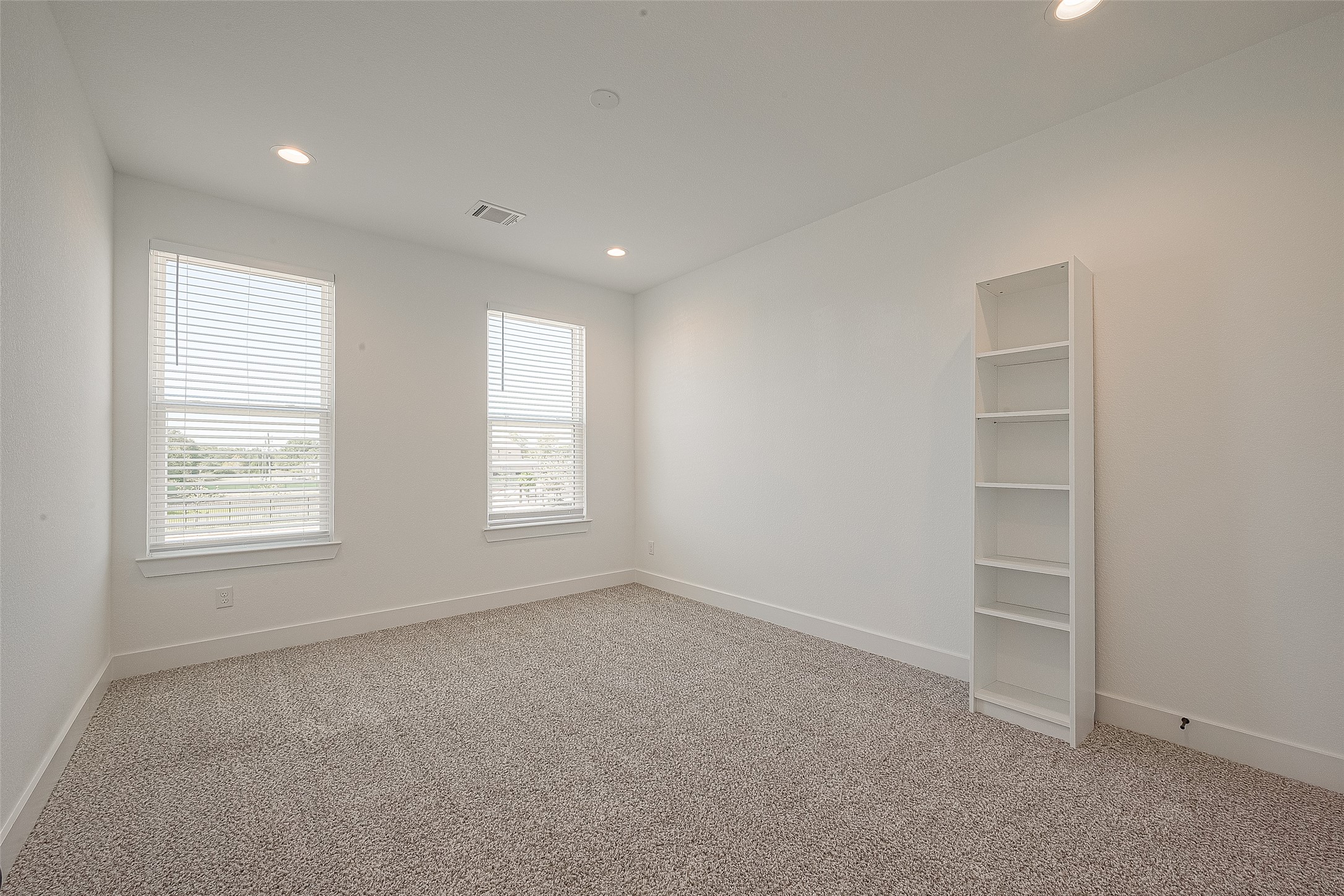 13419 Scott Street Houston, TX 77047 - Photo 13 of 23 an empty room with windows and closet
