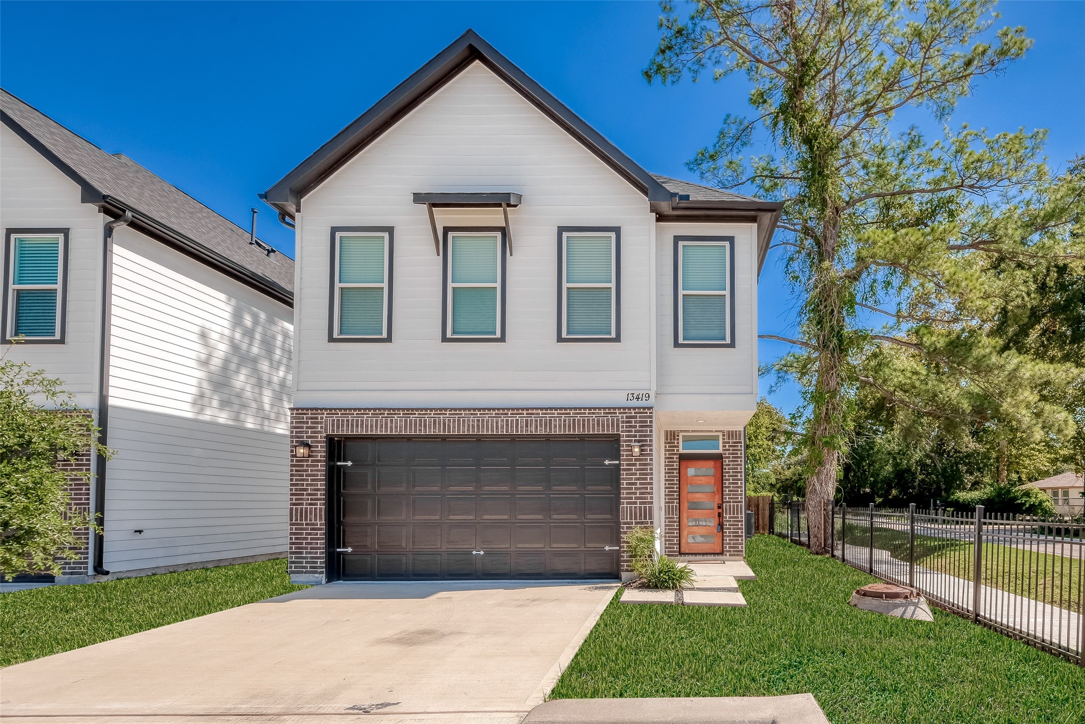 13419 Scott Street Houston, TX 77047 - Photo 2 of 23 a front view of a house with a yard