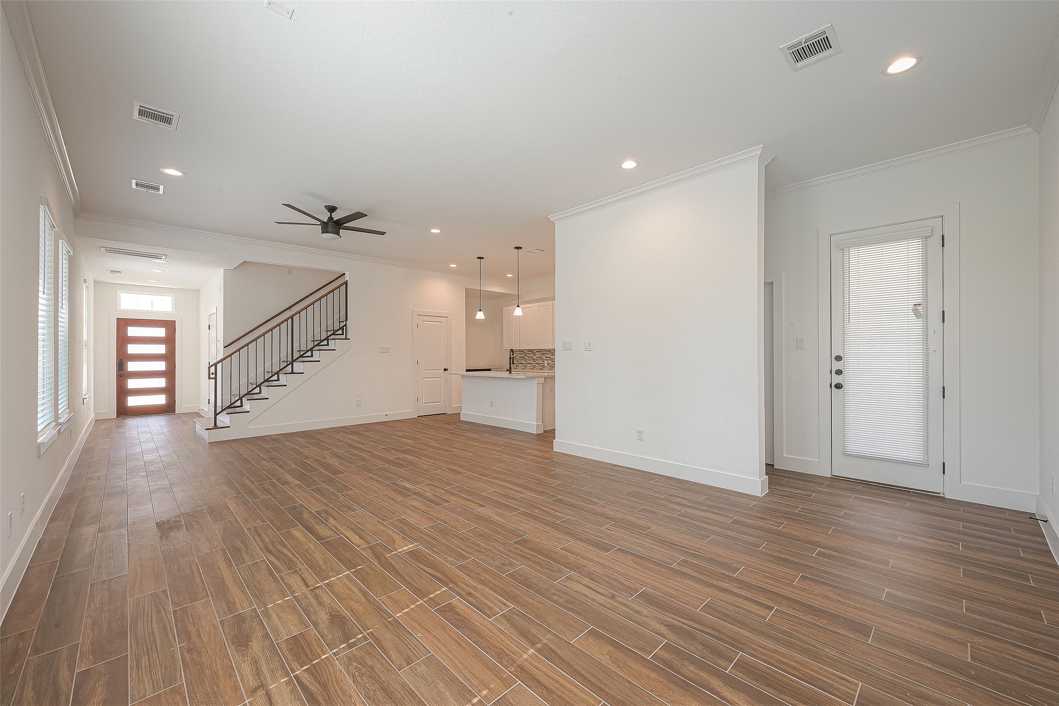13419 Scott Street Houston, TX 77047 - Photo 6 of 23 an empty room with wooden floor and windows