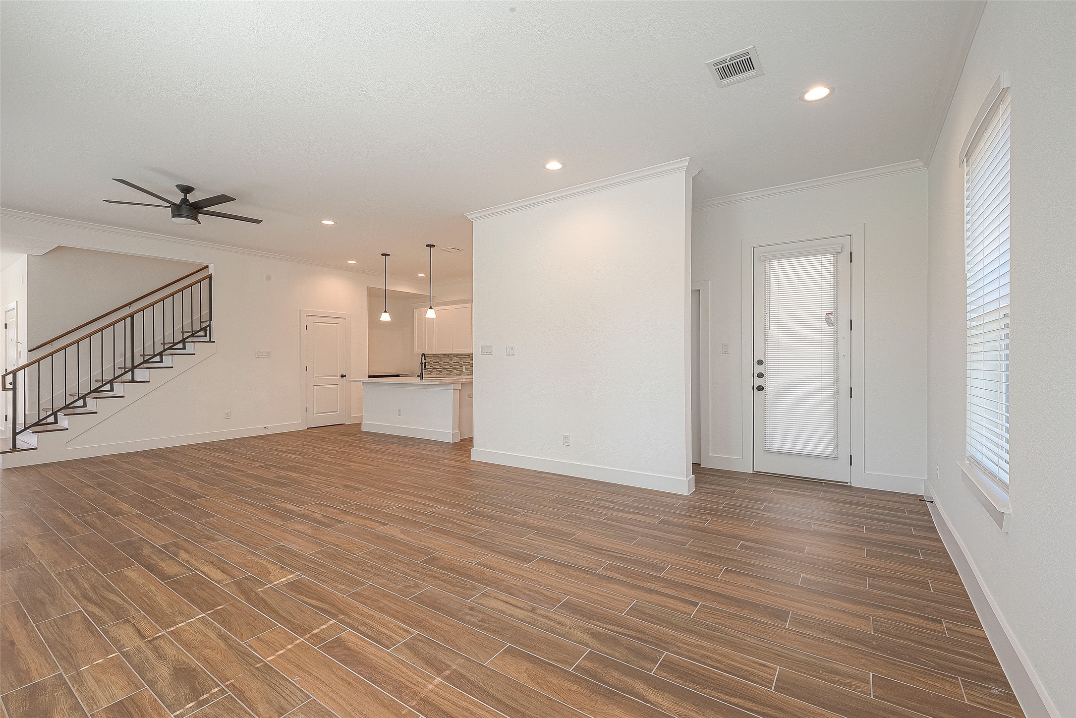 13419 Scott Street Houston, TX 77047 - Photo 7 of 23 a view of an empty room with wooden floor and a window