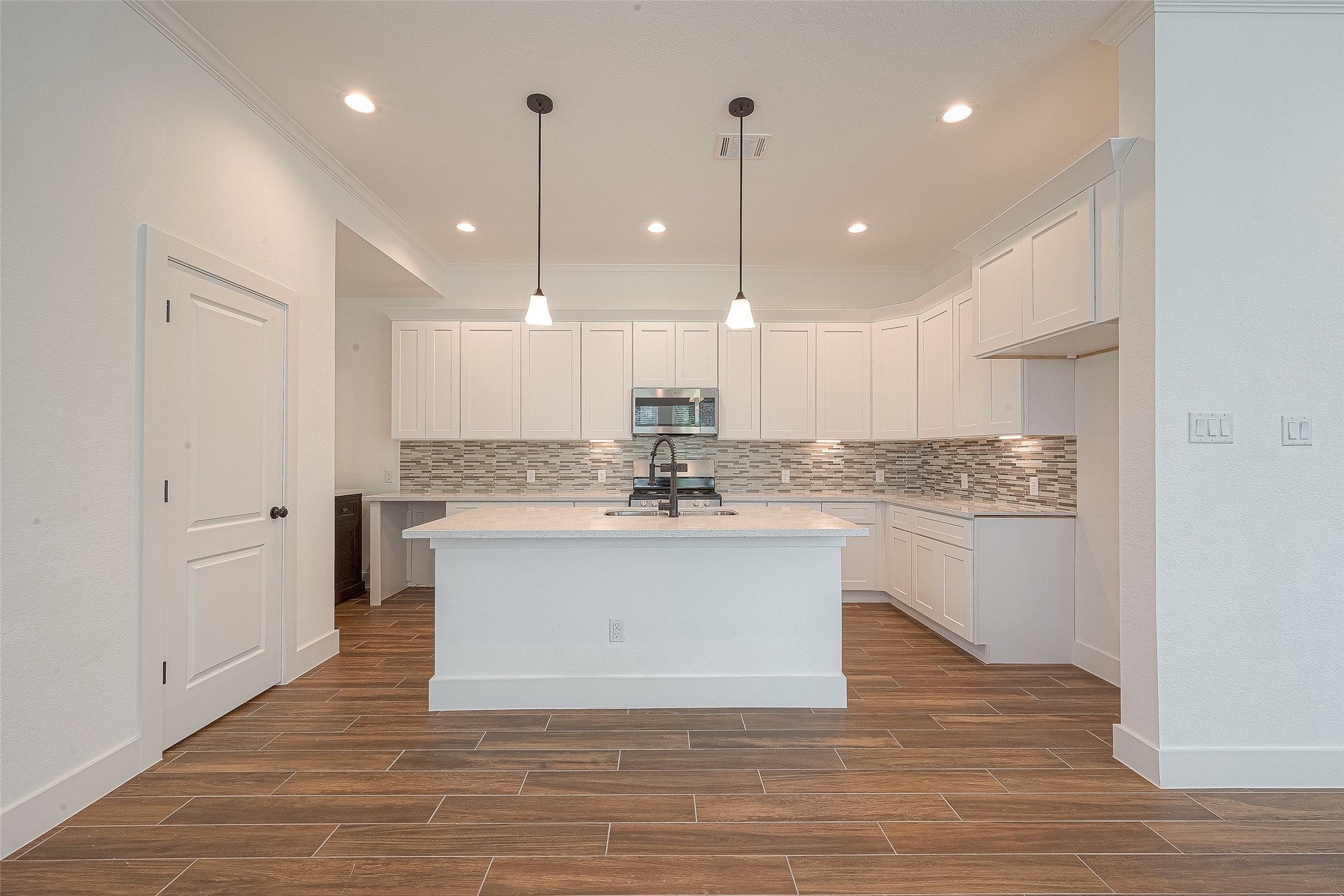 13419 Scott Street Houston, TX 77047 - Photo 9 of 23 a view of kitchen with granite countertop appliances white cabinets and a sink