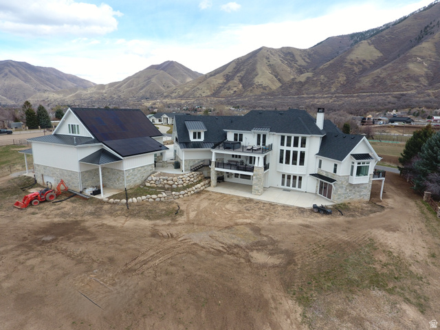 1354 South 800 East Mapleton, UT 84664 - Photo 113 of 129 Back of house featuring stone siding, a patio area, a chimney, french doors, and dirt driveway