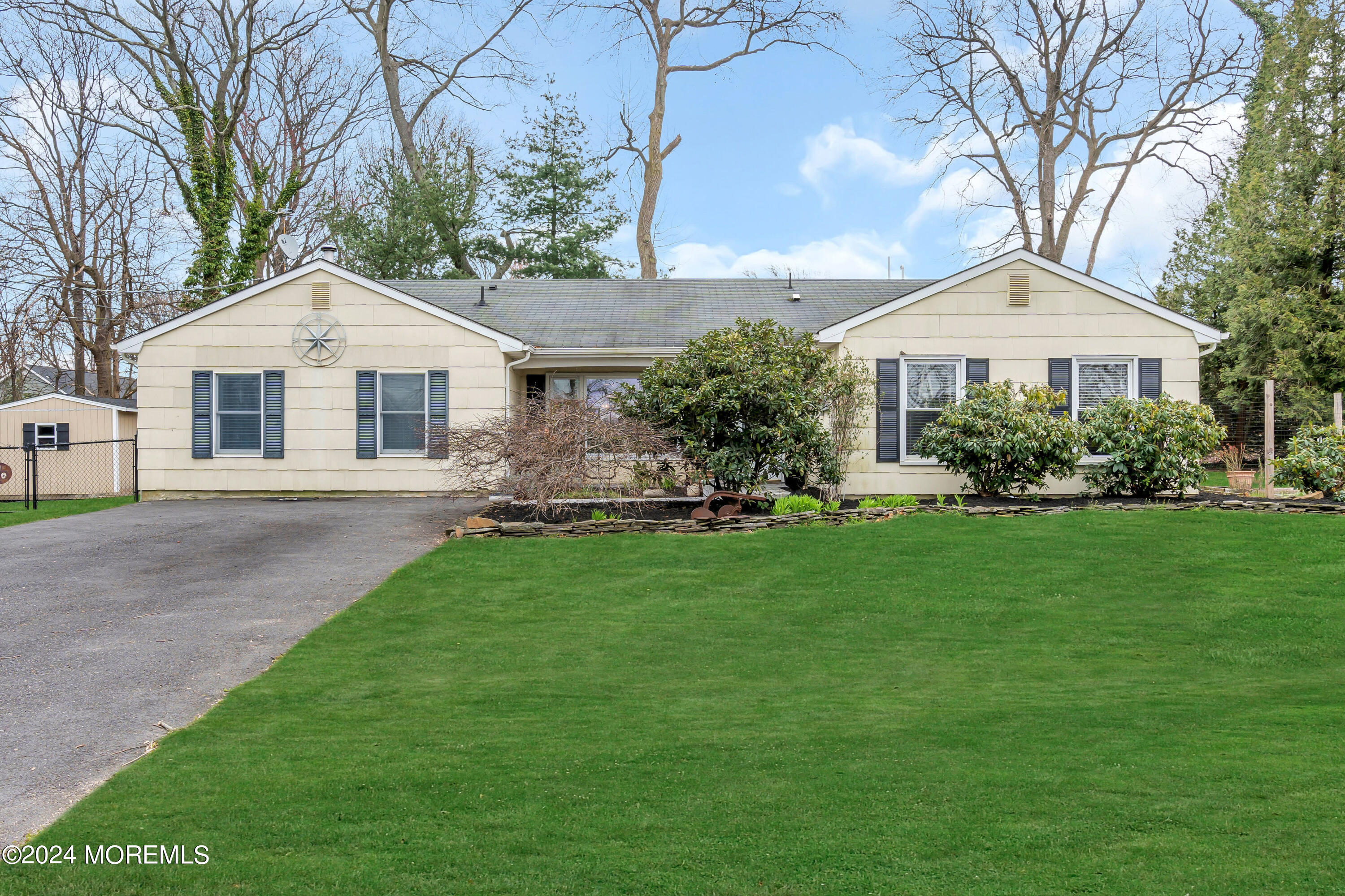 70 Portland Road Atlantic Highlands, NJ 07716 - Photo 1 of 32 a front view of a house with a garden and plants