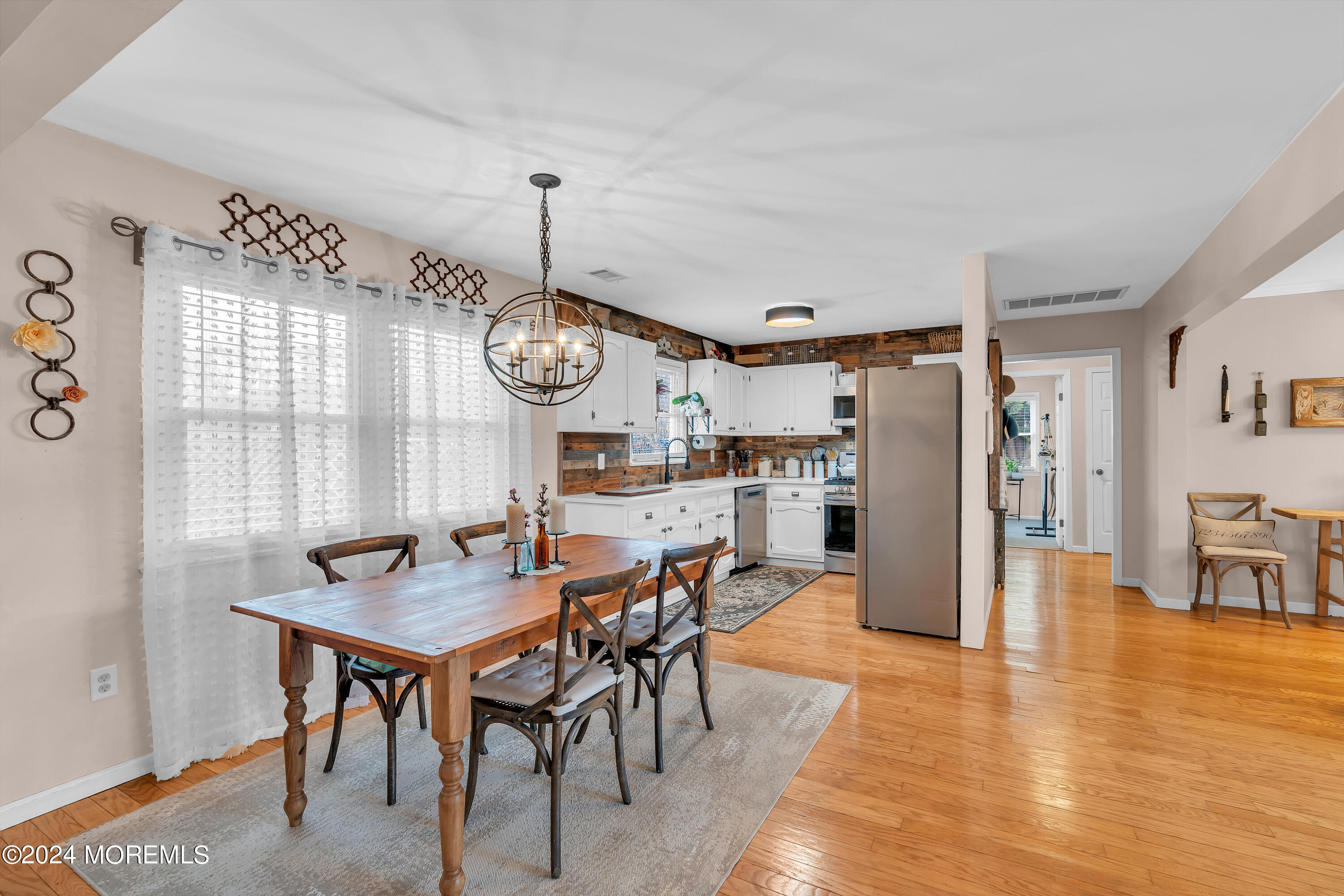 70 Portland Road Atlantic Highlands, NJ 07716 - Photo 13 of 32 a view of a dining area with furniture window and wooden floor