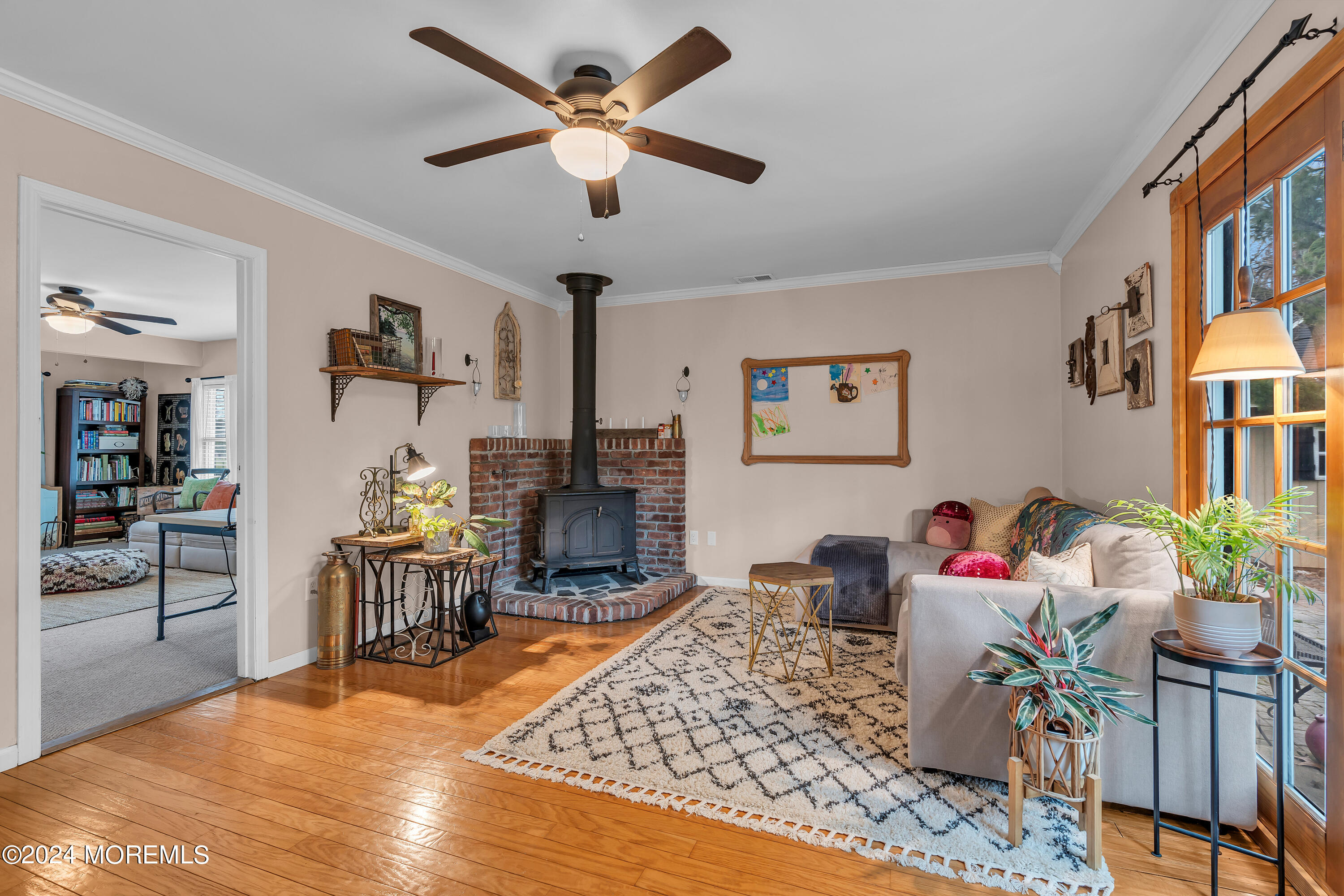 70 Portland Road Atlantic Highlands, NJ 07716 - Photo 8 of 32 a living room with furniture dining table and a chandelier
