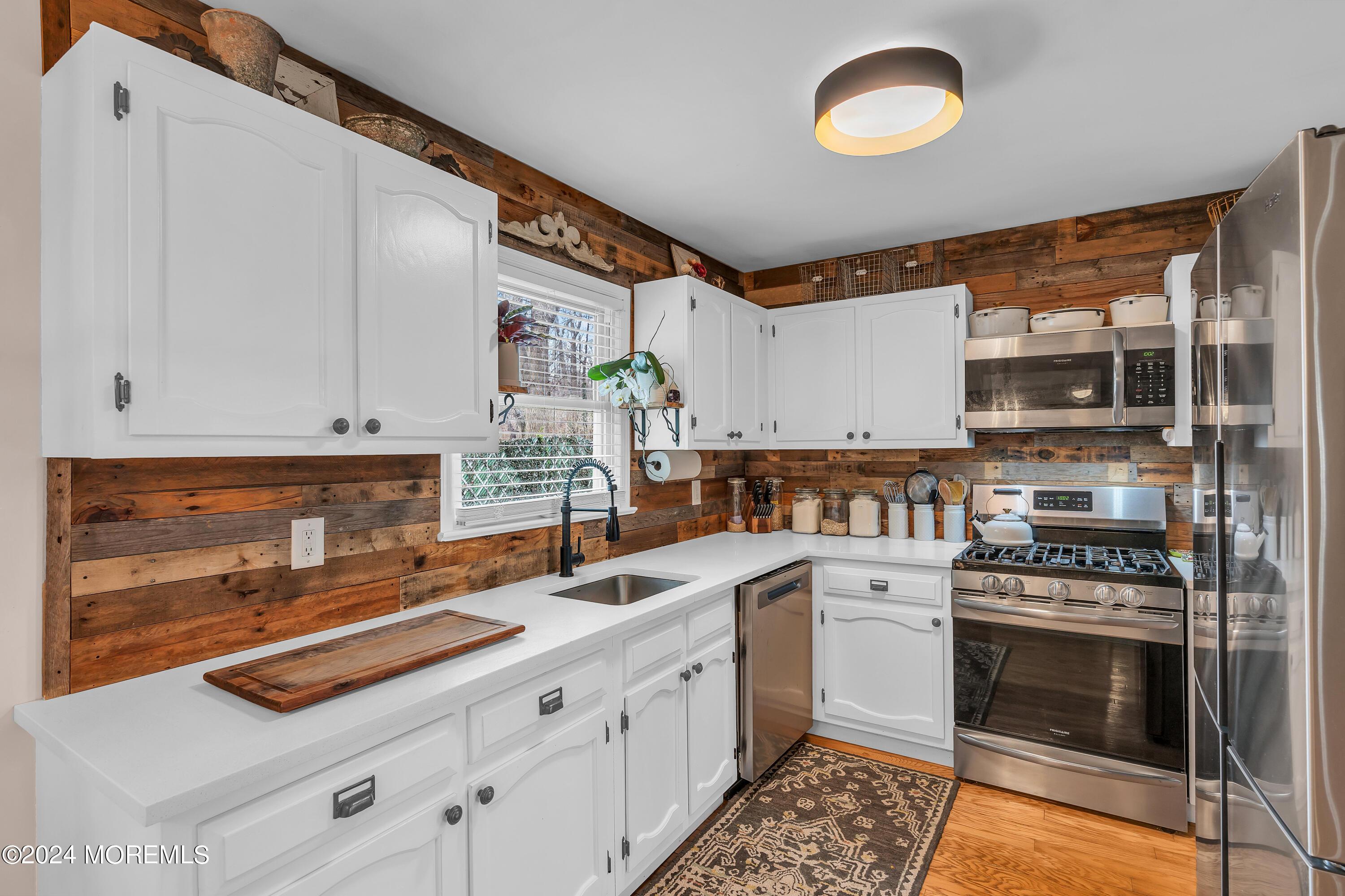 70 Portland Road Atlantic Highlands, NJ 07716 - Photo 10 of 32 a kitchen with stainless steel appliances a stove cabinets and a counter top