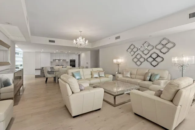 a room with furniture and a floor to ceiling window