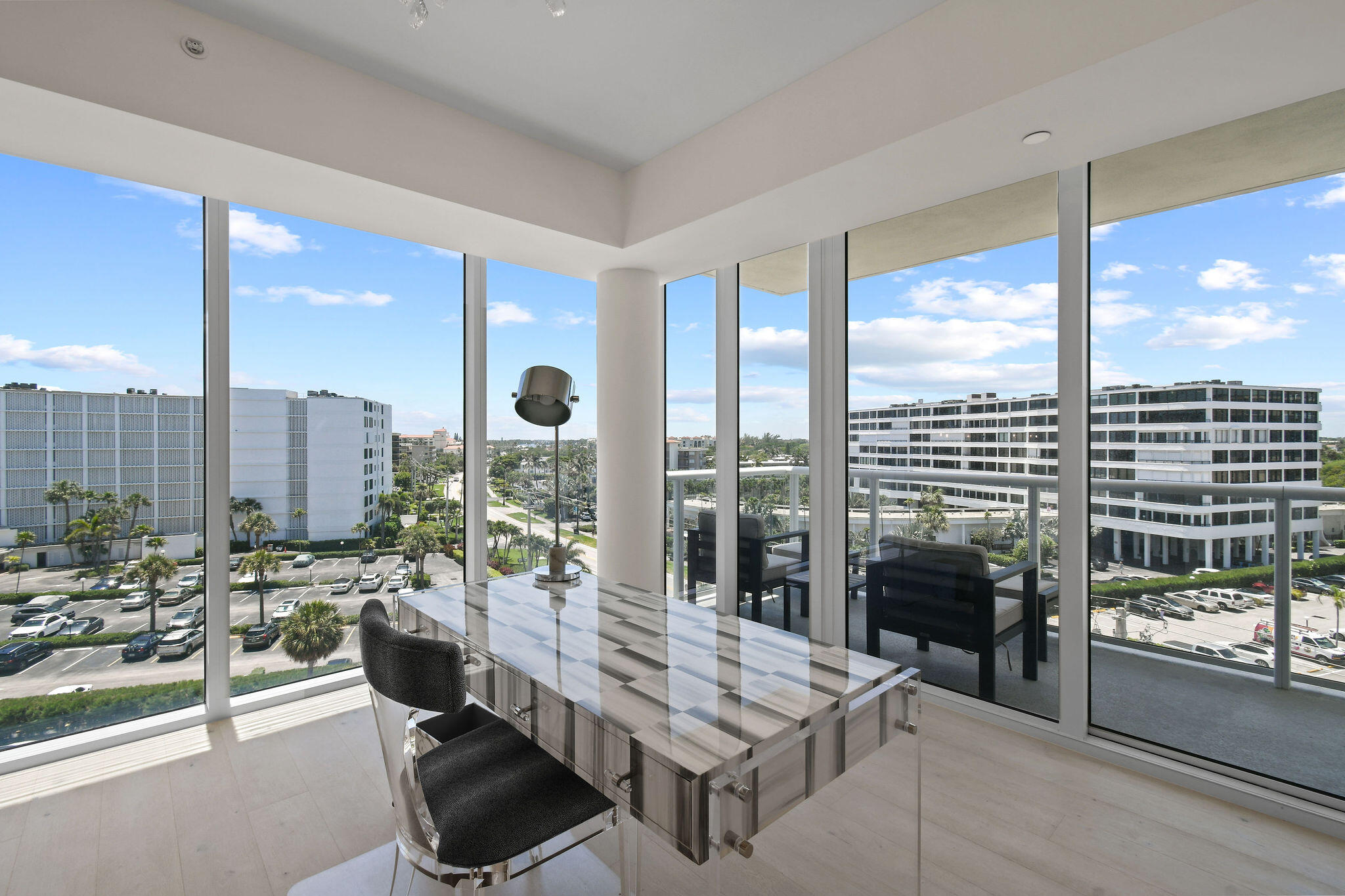3550 South Ocean Boulevard, Unit 5E South Palm Beach, FL 33480 - Photo 14 of 52 a room with furniture and a floor to ceiling window